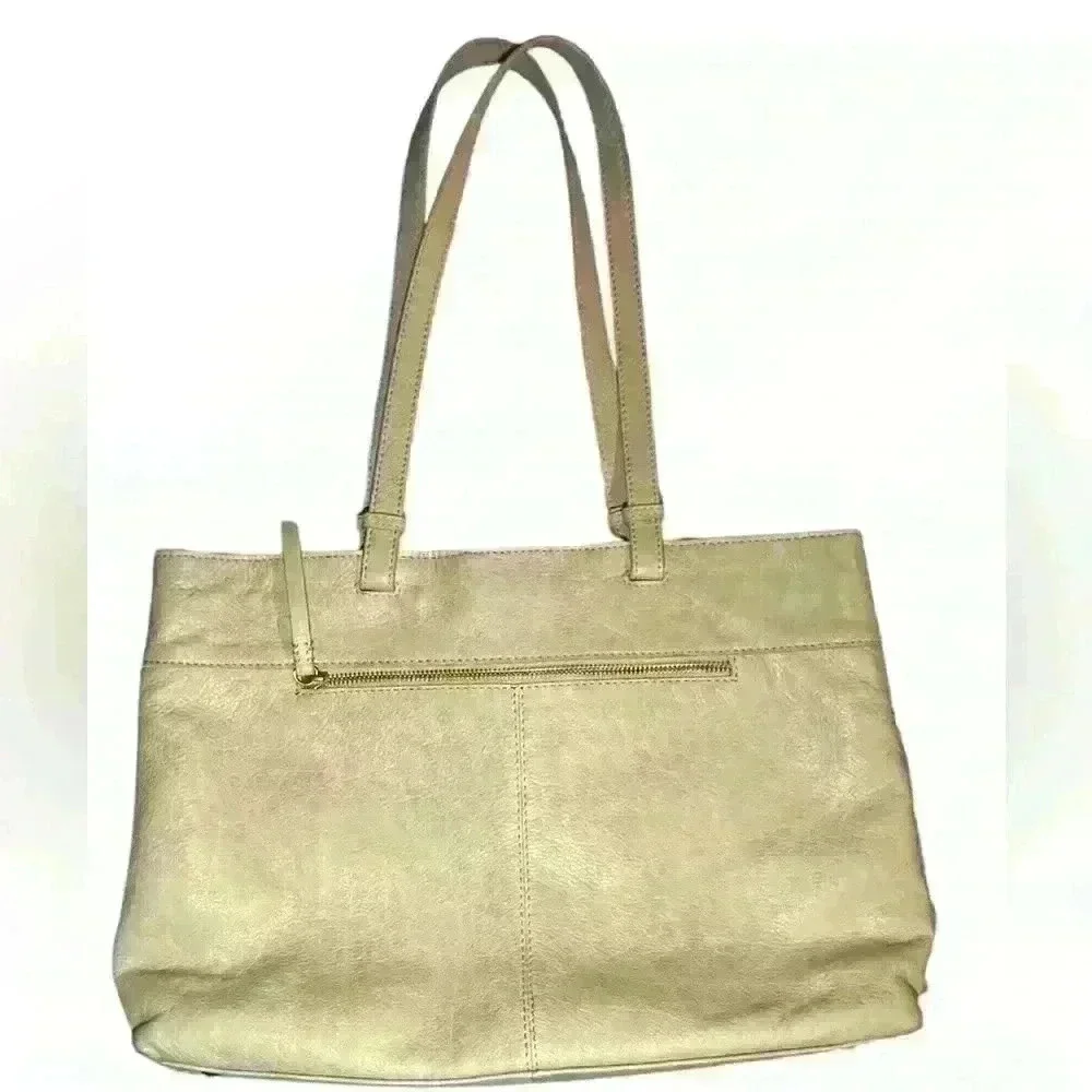 An American Leather Co. nude/cream colored leather woven tote bag.